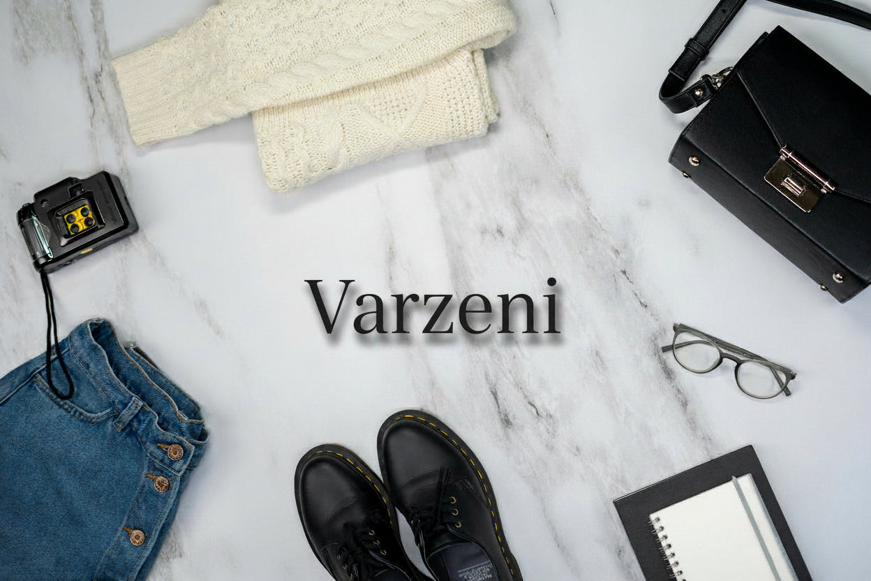 Collection of clothing and accessories on a marble surface