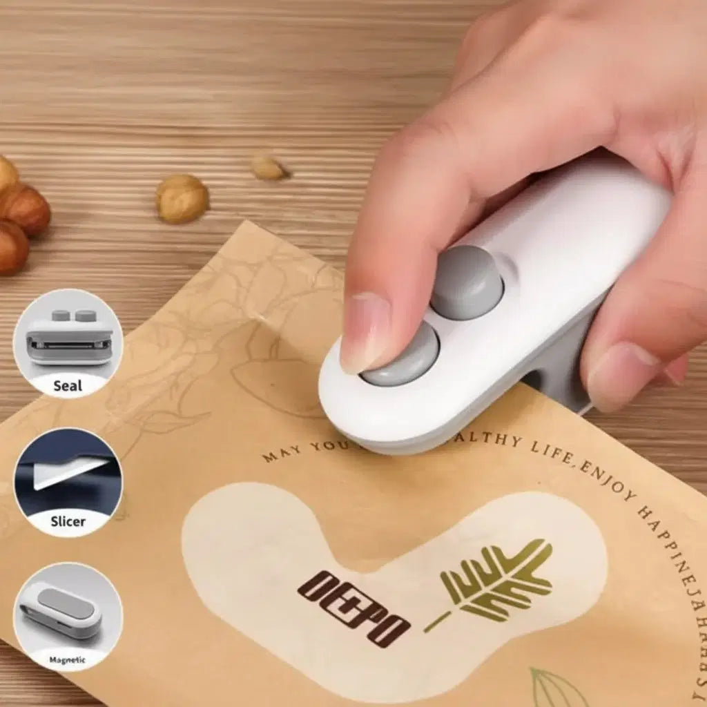 Handheld portable vacuum sealer machine sealing a food storage bag, compact mini heat bag sealer for easy kitchen use